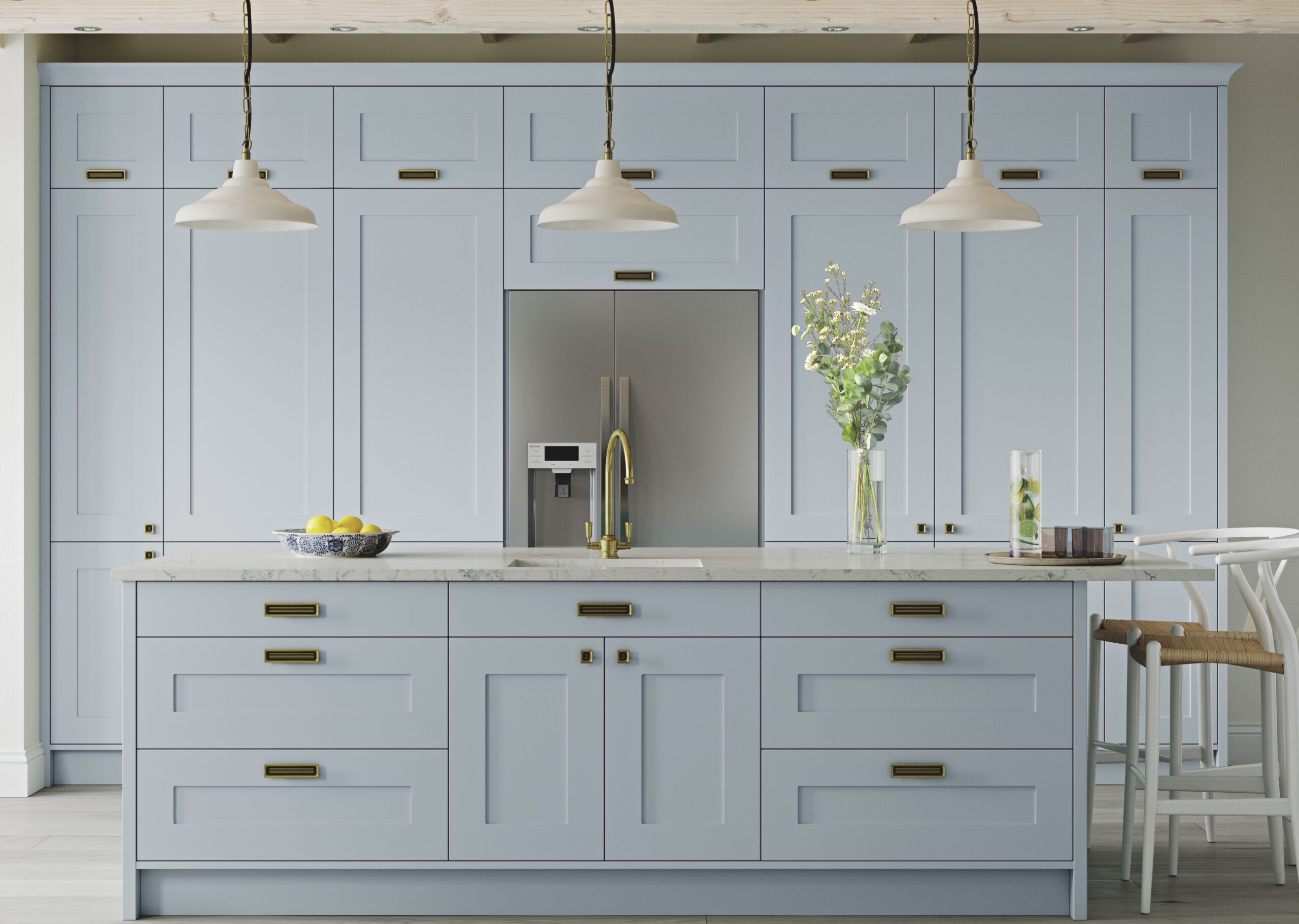 Light blue solid wood kitchen with shaker‑style cabinets, bright worktops, and a spacious, airy layout.