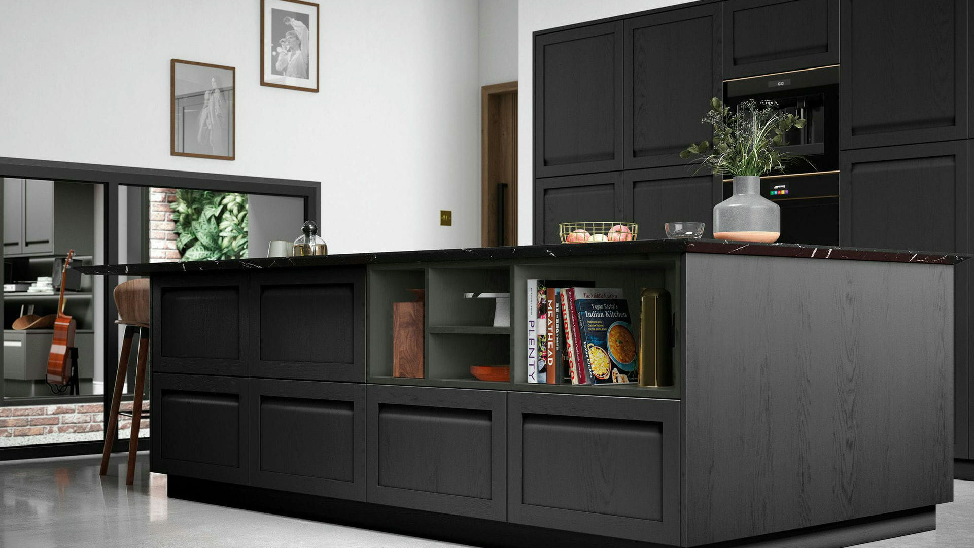 Handleless graphite kitchen with classic traditional styling, deep grey cabinetry, and dark worktops for a warm, timeless interior.