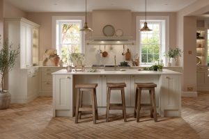 A pastel pink shaker kitchen with a shaker styler kitchen island