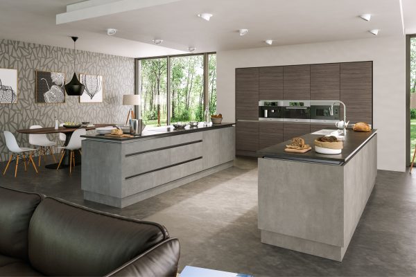 A sleek kitchen with light concrete matt textured cabinetry and a minimalist design, creating a modern, industrial feel.
