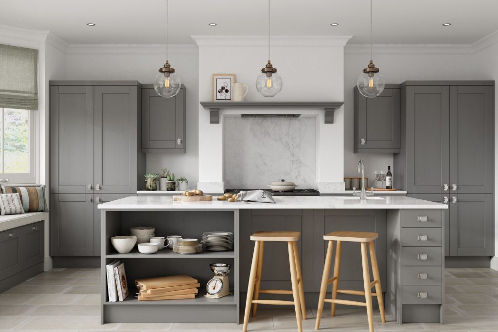 A dust grey shaker kitchen featuring classic cabinetry and light worktops, offering a timeless and inviting atmosphere.