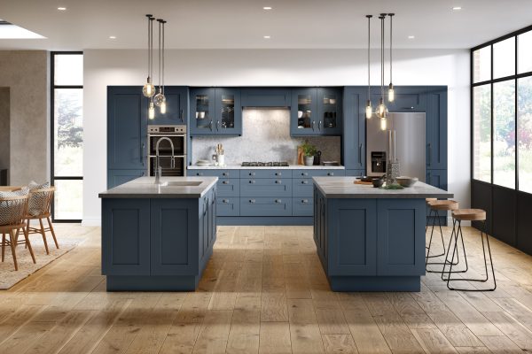 A luxury shaker kitchen in ocean blue with textured grey countertops, blending rich colour and tactile surfaces.