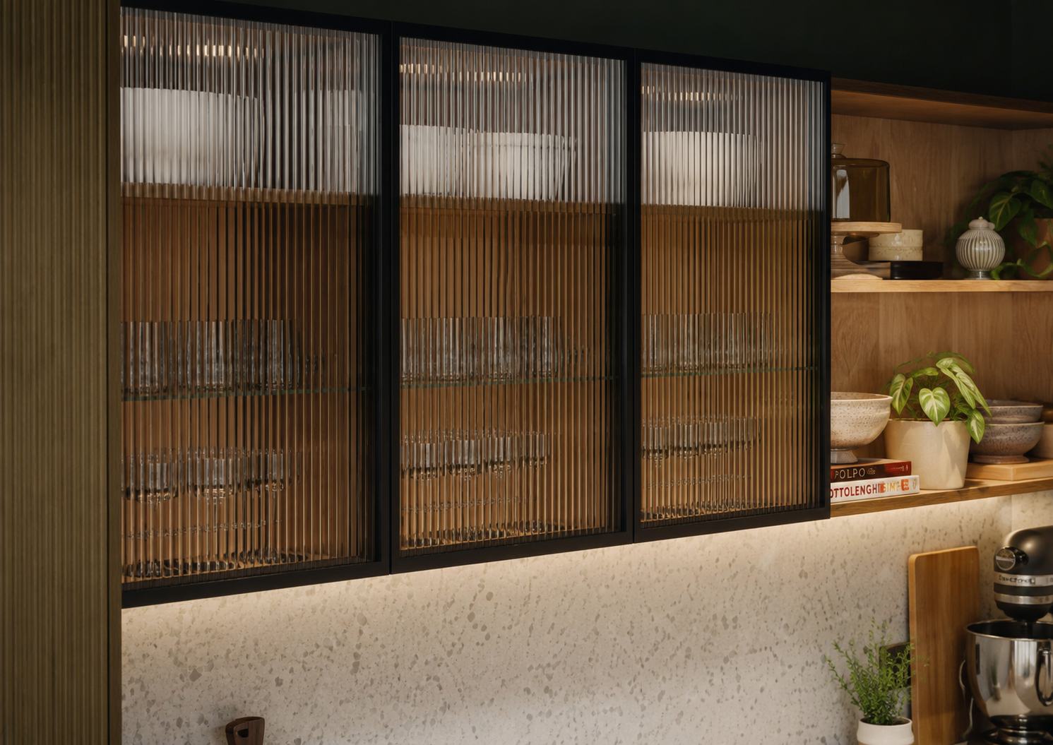 Luxury kitchen units with thin black frames and fluted glass